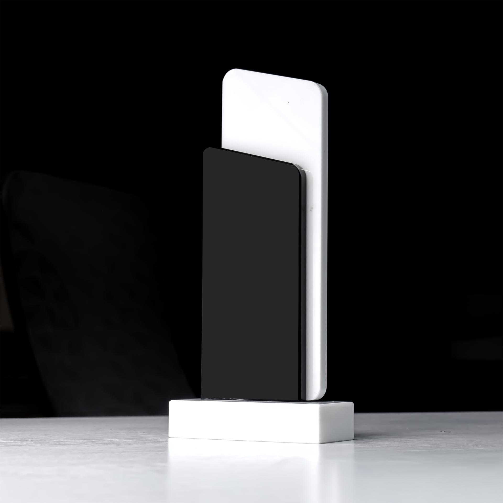 Pinnacle Black and white crystal trophy. (2)